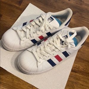 Adidas superstar shoes. White blue red colored